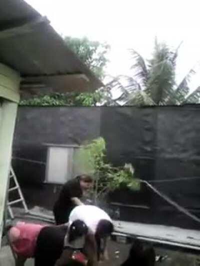 WCGW holding the pinata string balanced on a wall at the top of a ladder...?