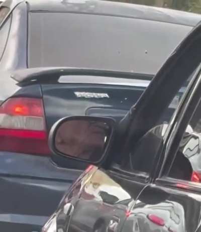 Denture adjust mid traffic jam