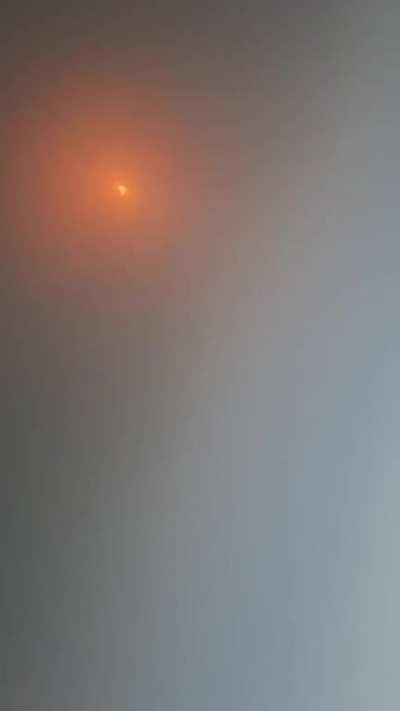 *watch the whole thing-eclipse of the sun(Korea)-Using a chips packet to see it cus I can't see it with my bare eyes