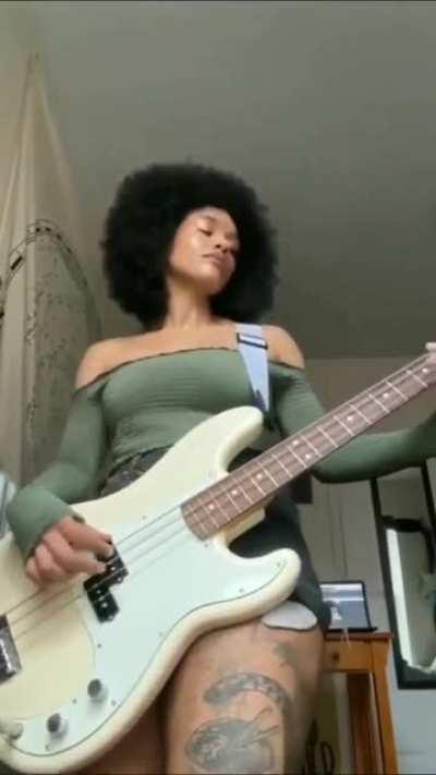 I like how this lady grooves with her bass. Amazing !