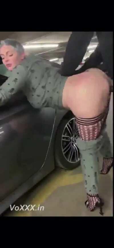 Couple going wild in the parking lot