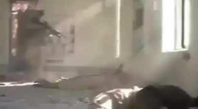 A US Marine shoots dying insurgent that was faking being dead in the head killing him instantly inside a mosque in Fallujah, 2004. Other Marines killed the other dying insurgents but none of the Marines were charged.