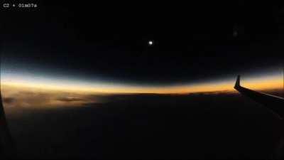 Solar eclipse occurring mid-flight