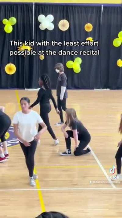 This kid can’t be less excited to be there