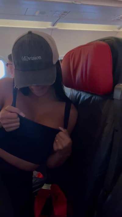 Her tits on a plane