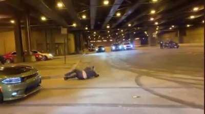 Hanging out the window while doing donuts.