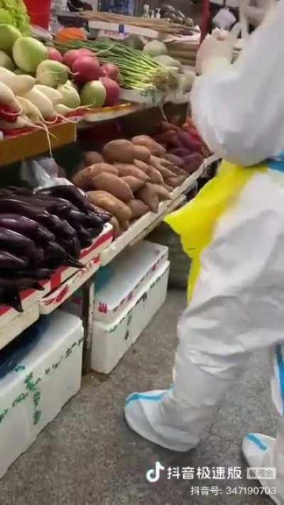 Testing vegetables for covid at wet markets in China