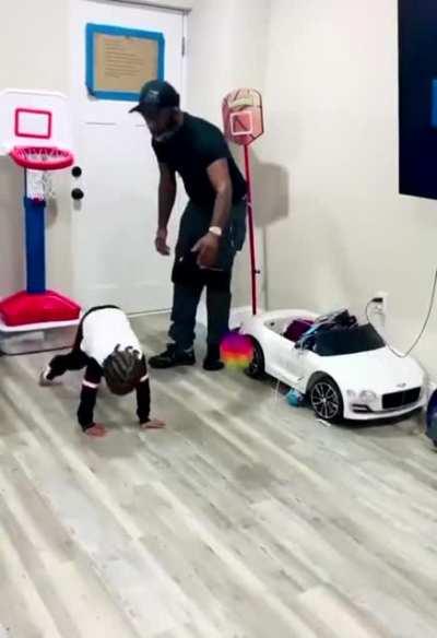 Dad Blocks toddler from shooting a basket and toddler isn’t having any of it