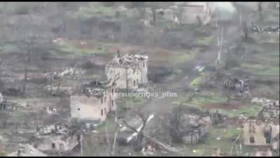 ua pov Ukrainian tank follows a group of retreating Russians in Soledar and shells them at close range. They move place to place while being targeted, with one hit directly on their position inside a demolished structure