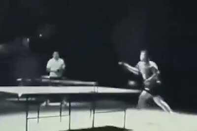 bruce lee playing table tennis with nunchucks as part of a nokia advert