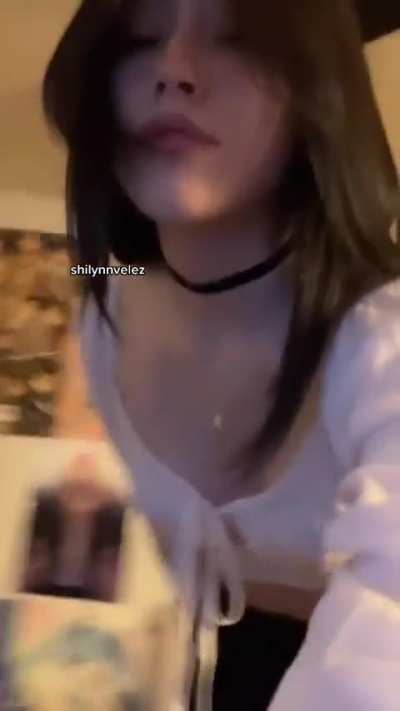 Leaning over in white