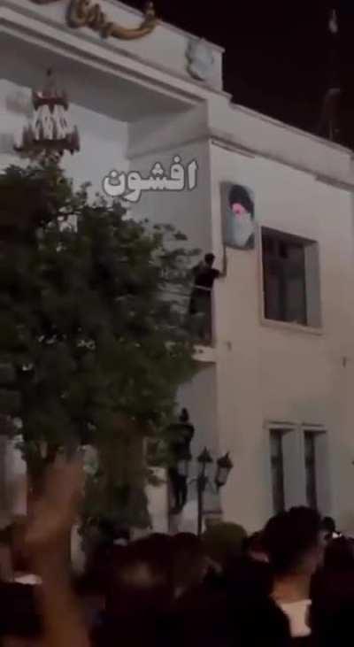 Protesters in Iran have begun tearing down portraits of religious leaders Khamenei and Khomeini from government buildings.