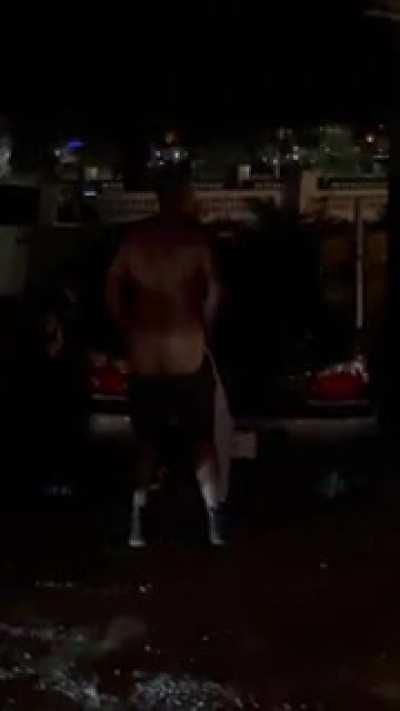 Florida man in his element. Drunk and pissing on a random car with 500 onlookers.