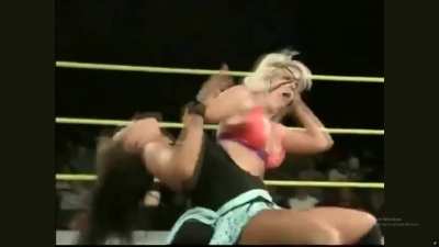 A young Mickie James is punished and displayed.