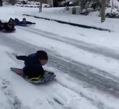 Someone called the police on kids sledding down a road so the cops investigated