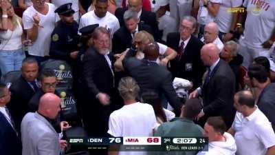 [Highlight] A stretcher gets brought out for a Heat fan while the rim gets repaired