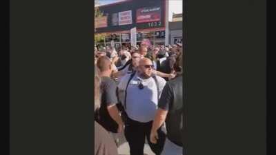 Counter protester kicks bike at Sturgis Rally police arrest / save him