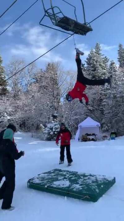 My friend Alex falling getting stuck to the lift at Sundance utah