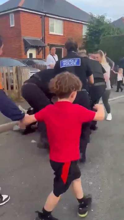 Police try to arrest a man