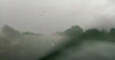 A BMW hydroplanes then flips