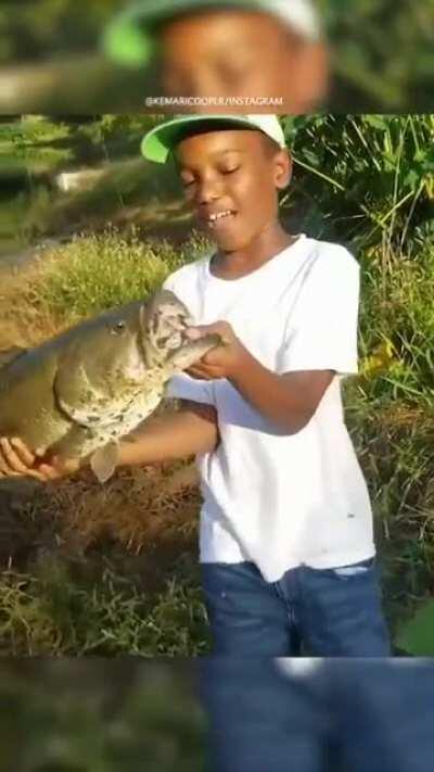 The Kids Smile Is As Big As The Fish