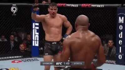Paulo Costa salutes Yoel Romero then punches him in the face