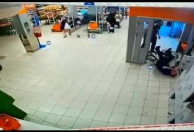 Russian shopper beats shop assistant who moved his bike outside the store.