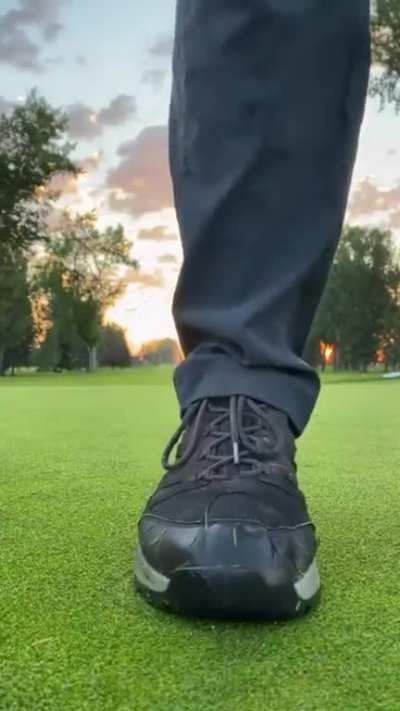 Greenkeeper covering a hole