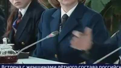 Putin's hand doing something weird at his 