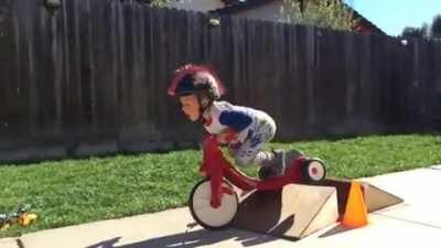 HMJB while I ride my tricycle over a ramp
