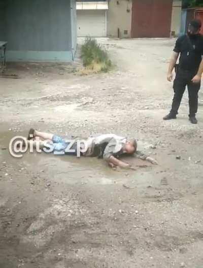 A man is being chased and tries to swim away