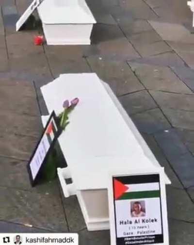 A Danish citizen in Copenhagen surprised people with 67 coffins and placed them in front of Parliament with the names of the martyrs of Gaza's children, so that the people and politicians feel the horror of Israel killing so many Palestinian children