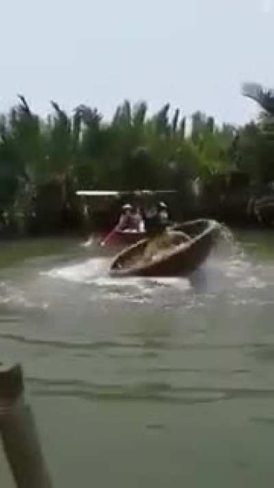 Vietnamese fishing boat . . . but I don't think he's fishing.