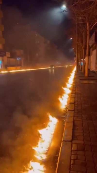 Roads burst into flames in Tehran after fuel from an oil depot hit by US/Israel leaks into city sewers.