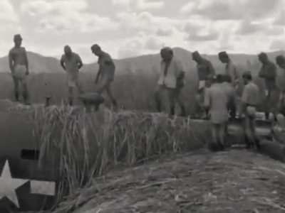 Japanese personnel inspect the remains of 374th Bomb Squadron B-24J Liberator 42-73312 after it force landed due to engine trouble over Burma on November 27th 1943