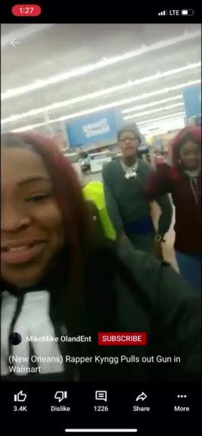 Flexing his guns in Walmart