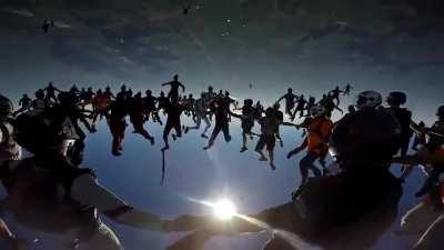 Camera man joins in on the action as 163 skydivers form a chain.