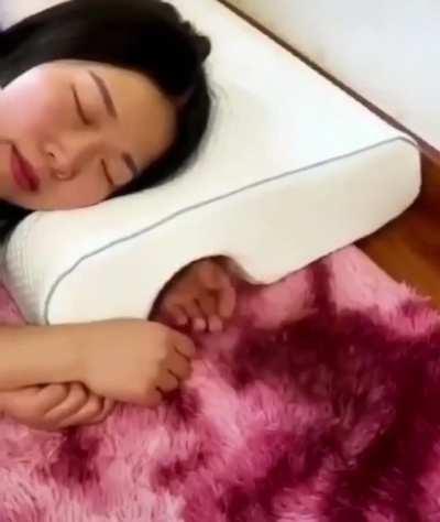 This new pillow has a hole for your arm.