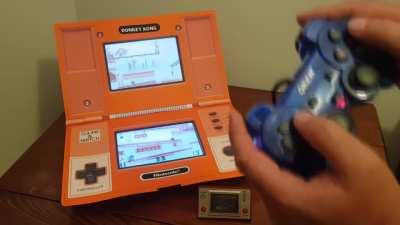 Proof of concept for a giant multi screen Donkey Kong. This is a 4:1 scale playable mock-up made from some orange Manila folders and two iPads for screens.