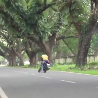 No-helmet rider can't control his bike, eats it hard.