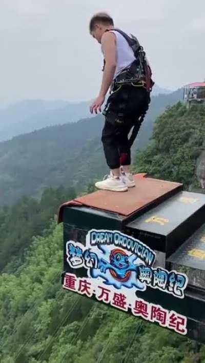 People crossing a bridge in costumes.