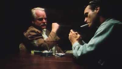Philip Seymour Hoffman and Joaquin Phoenix struggling to get through a scene without laughing (The Master, 2012)