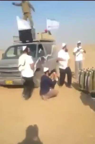 Leaked video of settlers and soldiers close to Gaza dancing and sticking stickers to missiles celebrating the killing of people in Gaza
