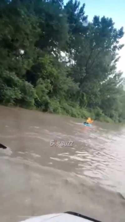 Two guys were seen kayaking in Toronto on the road to Cherry Beach.