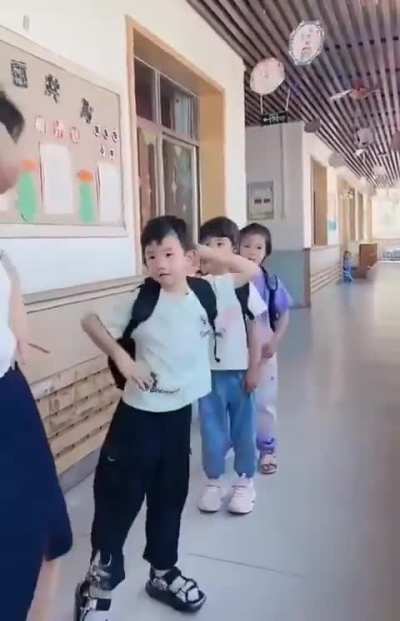 What a fun teacher! School dance for Chinese kids at the start of the day.