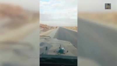 Syrian Army troops retreating are attacked by Syrian rebels with small firearms near Homs.