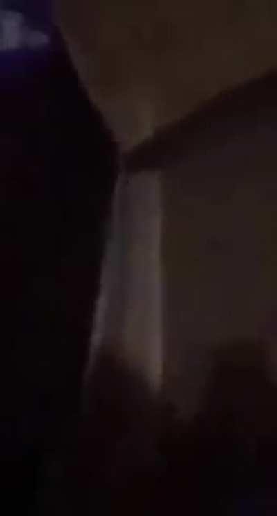 A Palestinian family prays to God in fear of death as Israel shells their neighborhood.