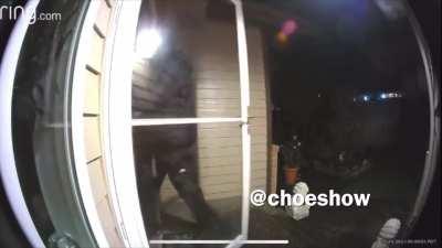 Asian American couple in Washington close their door milliseconds before a man with a gun tries to follow them in