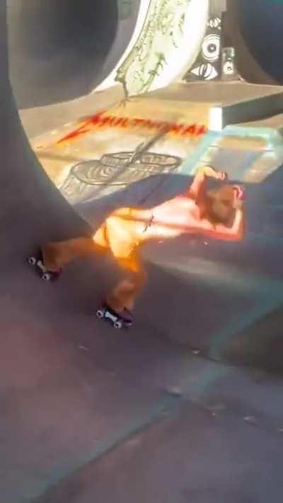 Just a chick in a skatepark doing flips on rollerskates