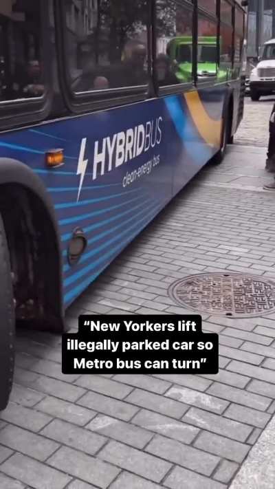 New Yorkers lifting up and moving a car so that a bus can turn
